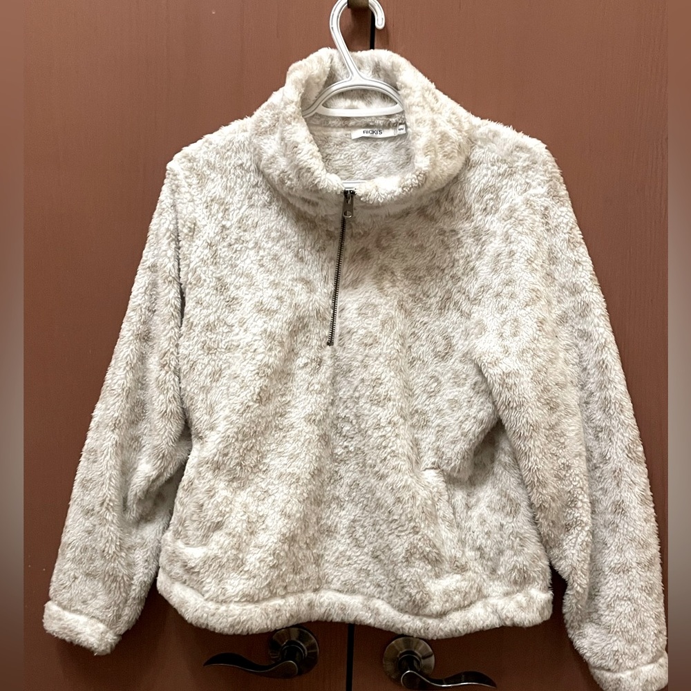 Ricki’s Medium Cream with tan spots warm & fuzzy top, cowl neck & 3/4 zipper.